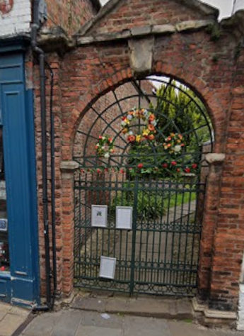The gated stepped access to the church.