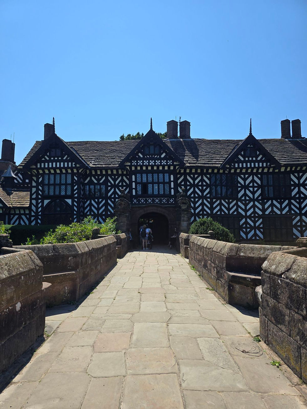 The stone bridge leading to Speke Hall's Tudor entrance.