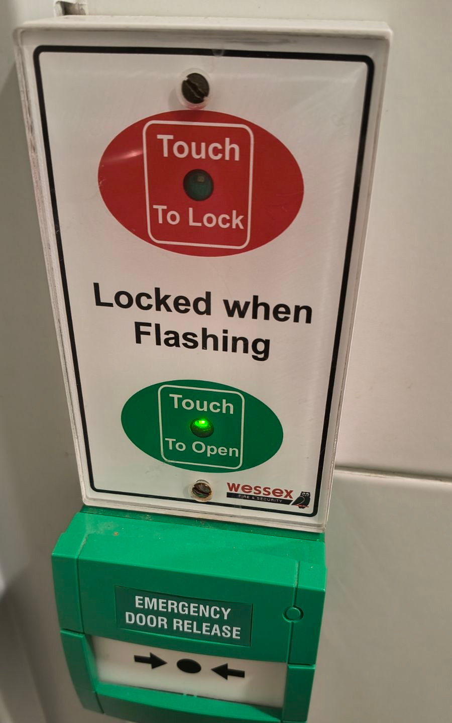 A touch screen to lock and unlock the accessible toilet doors with lights to show which button has been pushed.