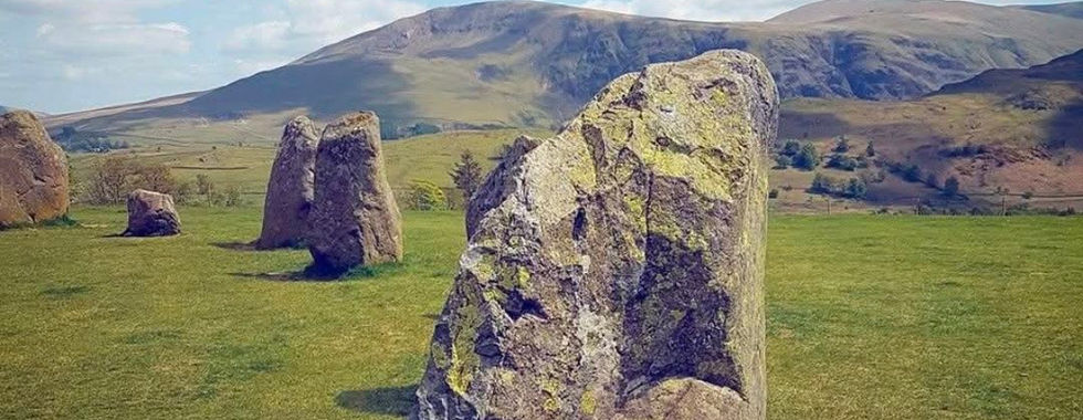 Castlerigg Stone Circle with hills in the background.
