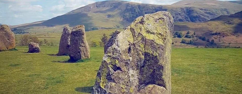 Castlerigg Stone Circle with hills in the background.