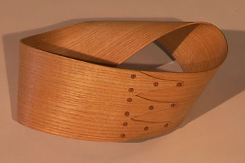 The Shaker style consists of simple lines and straightforward, recognizable shapes.  They could reasonably be viewed as the furniture’s iconic form.  This makes them great fun to play with.  No matter how far I bend, break or stretch them, their iconic identiy remains intact.