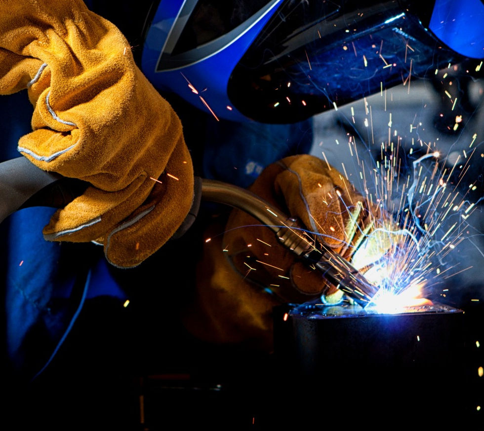 A Welder working on a part
