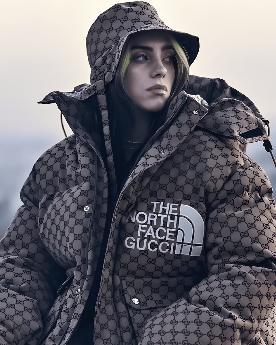 Billie Eilish usando um casaco puffer oversized com monograma Gucci, capuz e gorro, em um cenário de inverno sombrio.