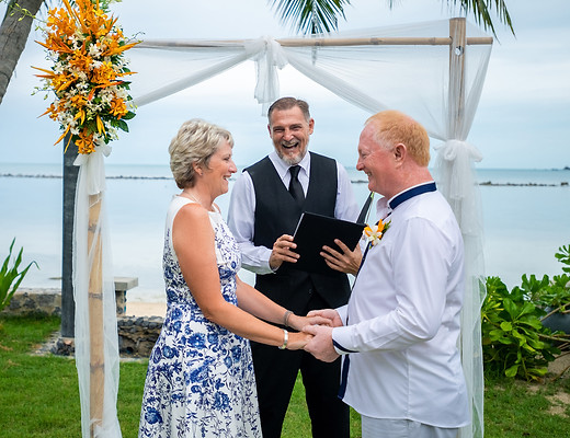 The Wed Guy and wedding couple laughing