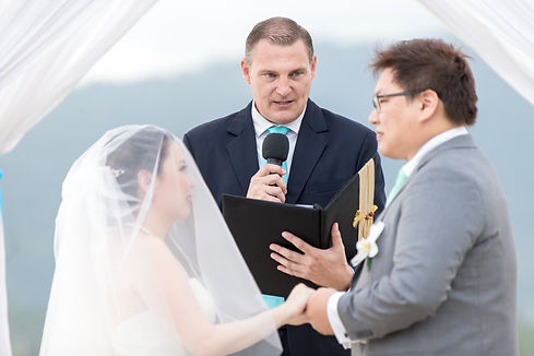 Reverend Carter performing a ceremony with a microphone