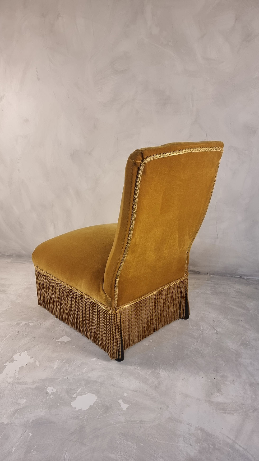 Slipper chair upholstered in original velvet fabric finished with gimp on the back