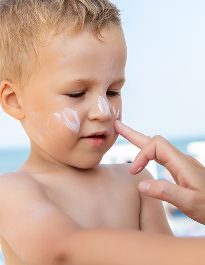mother-applying-sunscreen-protection-creme-on-cute-2025-01-10-12-40-21-utc.jpg