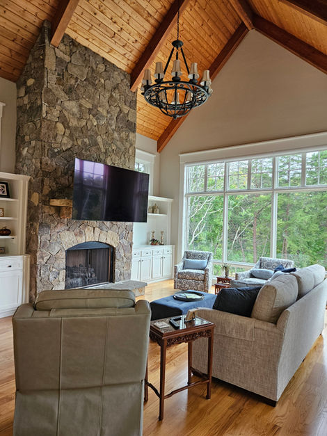 TV install in cozy living room setting above fireplace