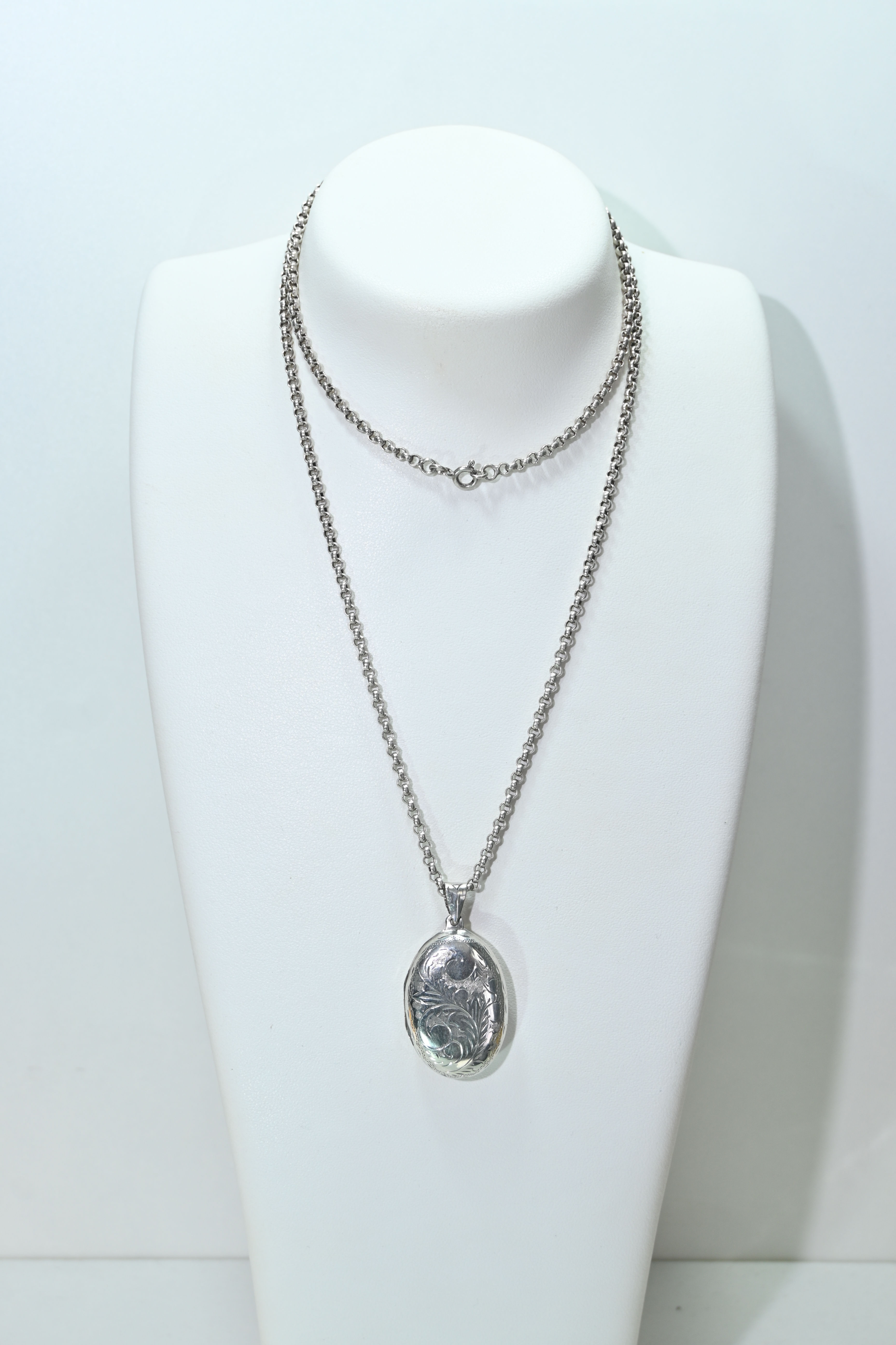 Silver locket and long silver chain