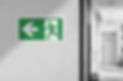 Fire exit sign in the corridor of the building.jpg