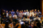 Group of youth and seniors celebrating on stage