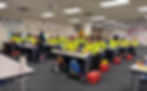 Workers in safety vests attending a training session