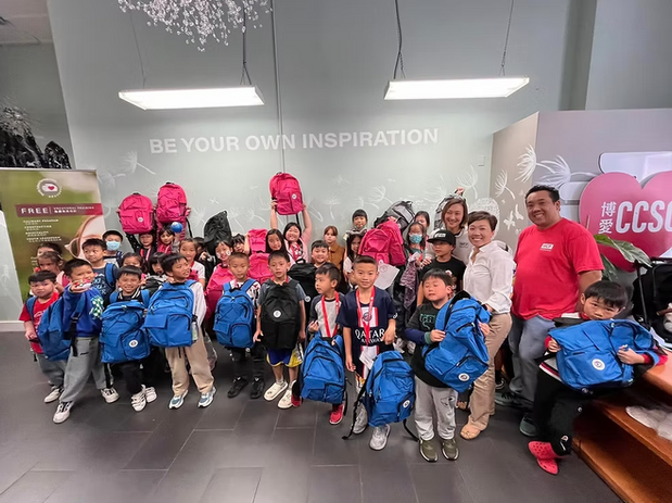 Annual backpack giveaway group photo with youth