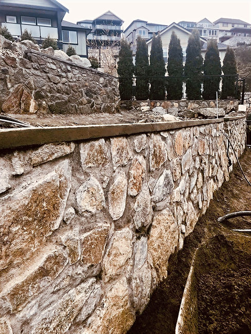 A mortared stone retaining wall built in Langford by Lennox Masonry