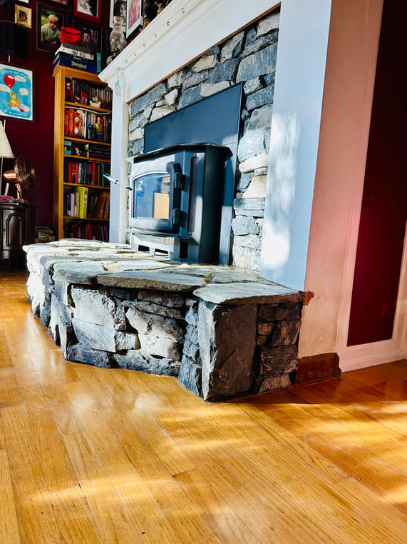 An interior stone fireplace built out of stone veneer and flagstone by Lennox Masonry in Saanich, BC