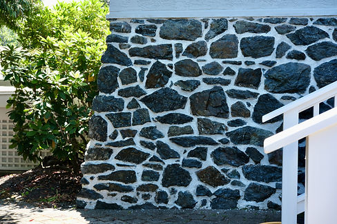 A heritage stone wall that has been repointed with traditional lime mortar by Lennox Masonry in the Cowichan Valley
