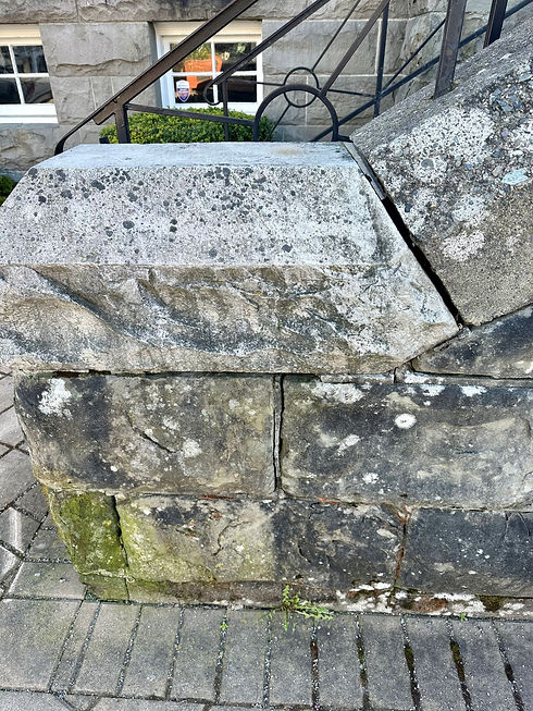 Crumbling mortar between heritage sandstones being repaired by Lennox Masonry