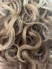 close up picture of blonde curly hair