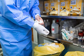 male-surgeon-removing-surgical-gloves-operation-theater-hospital.jpg