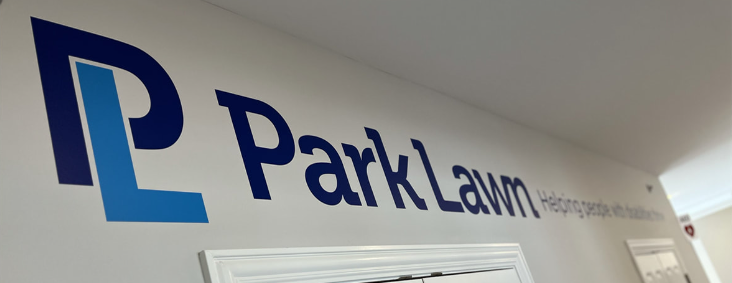 Park Lawn logo on a wall, Helping people with their lawn, Park Lawn.