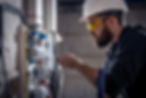 male-electrician-works-switchboard-with-electrical-connecting-cable (1).jpg