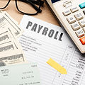 payroll-still-life-with-cash-high-angle.jpg