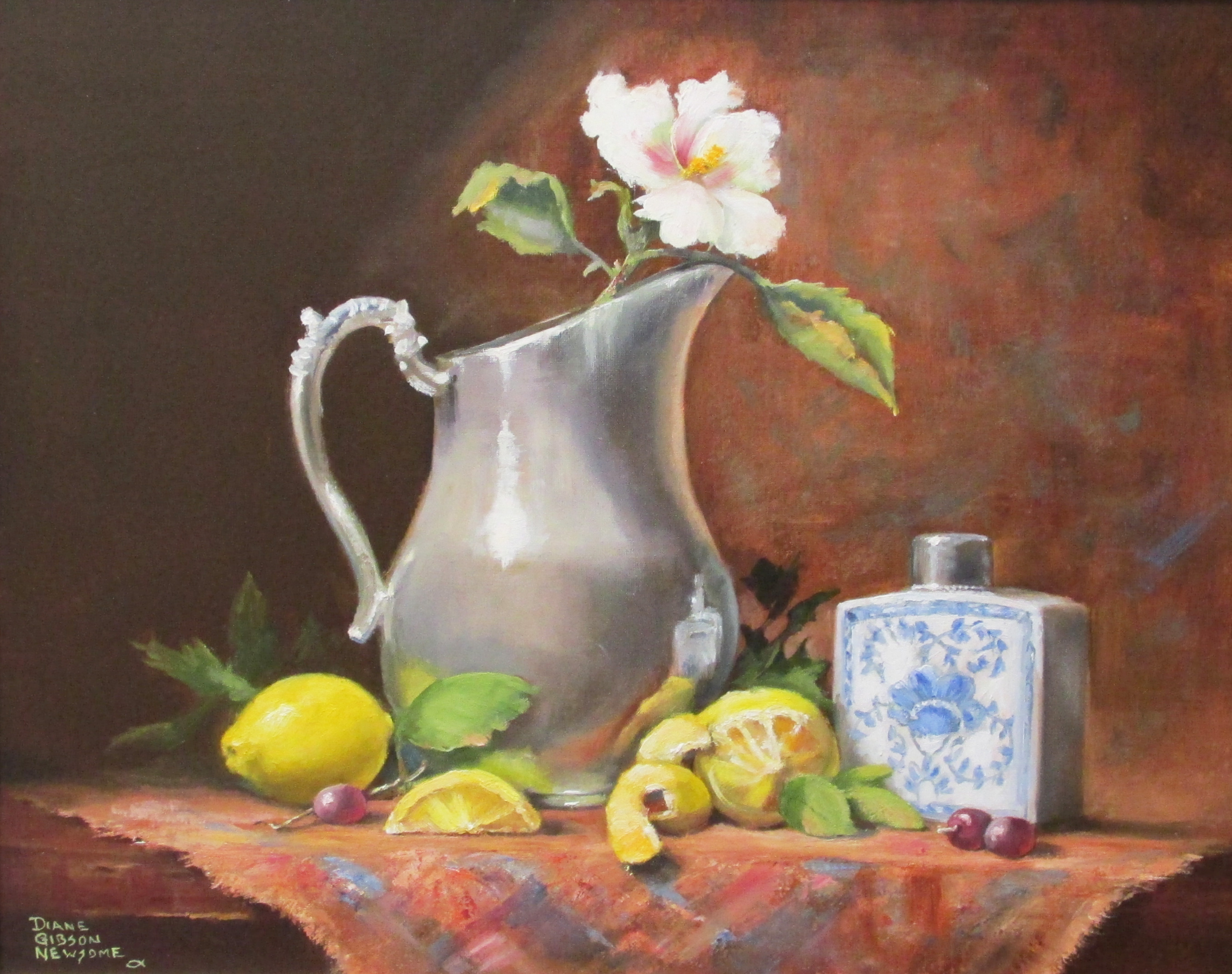 Silver Pitcher With Lemons