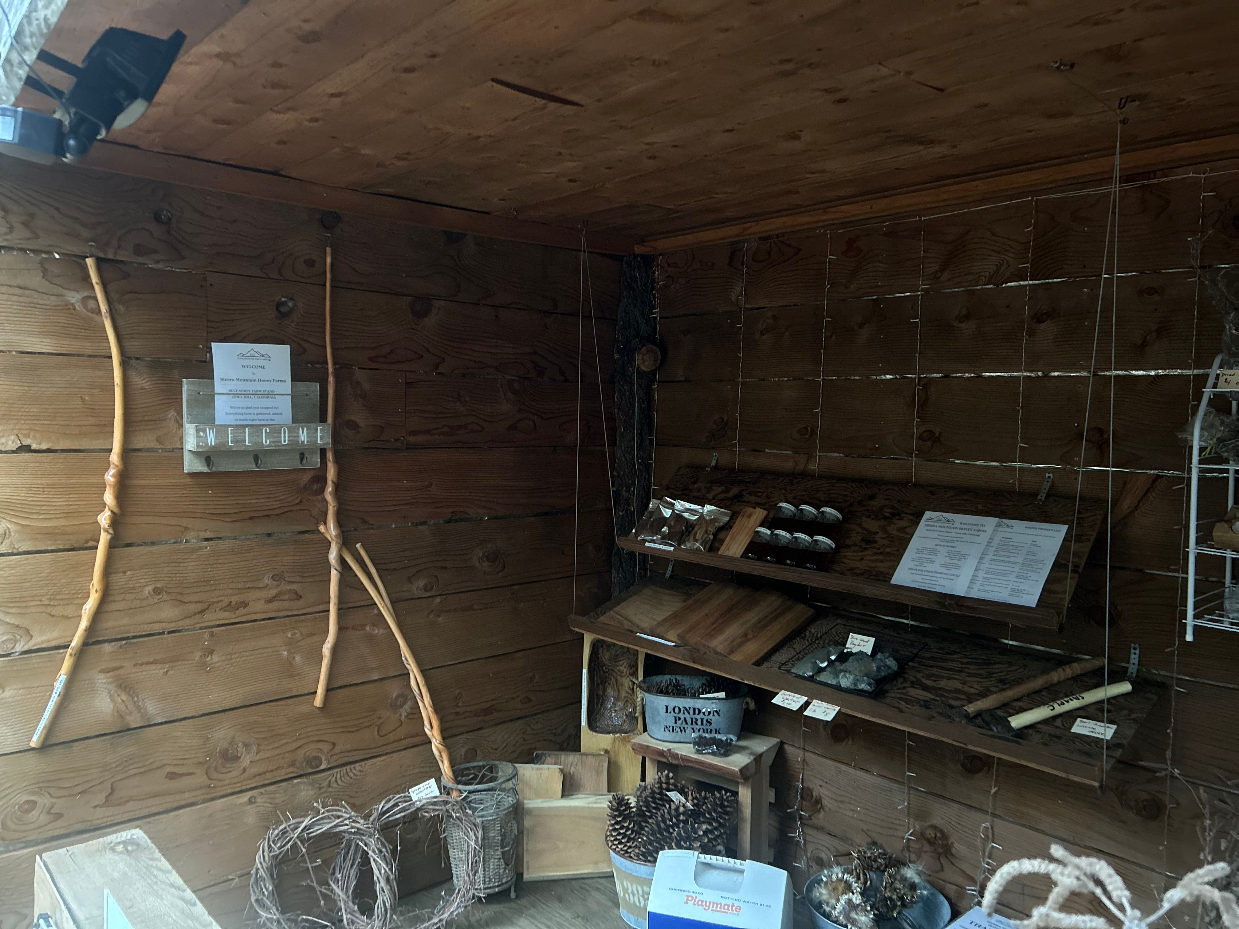 Handpicked walking and hiking sticks displayed at the Sierra Mountain Honey Farms farmstand