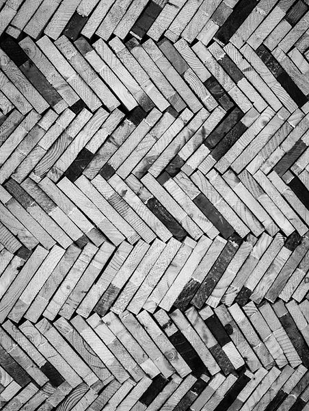 Stacked reclaimed timber planks