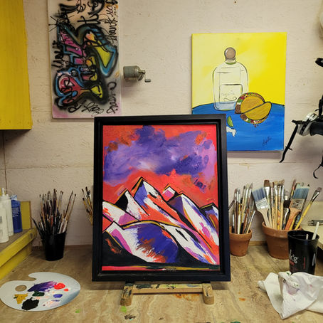 Painting of mountains in working studio