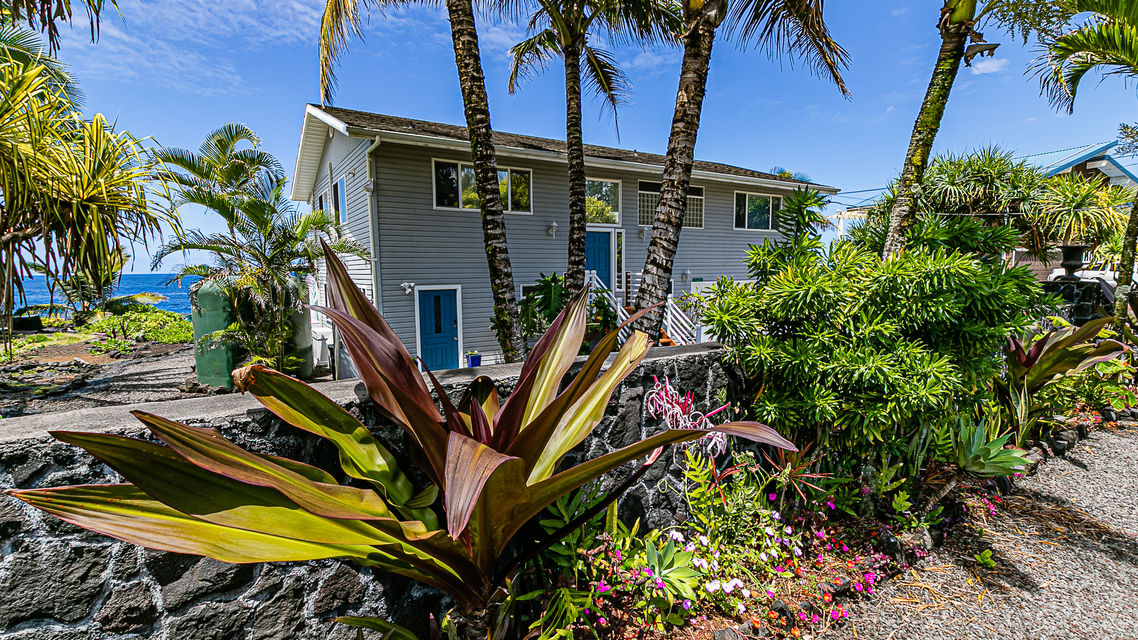 Paradise Breeze Retreat tropical oceanfront house exterior.