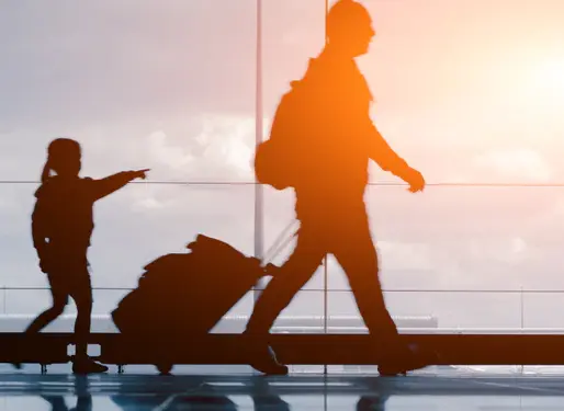 family walking through airport