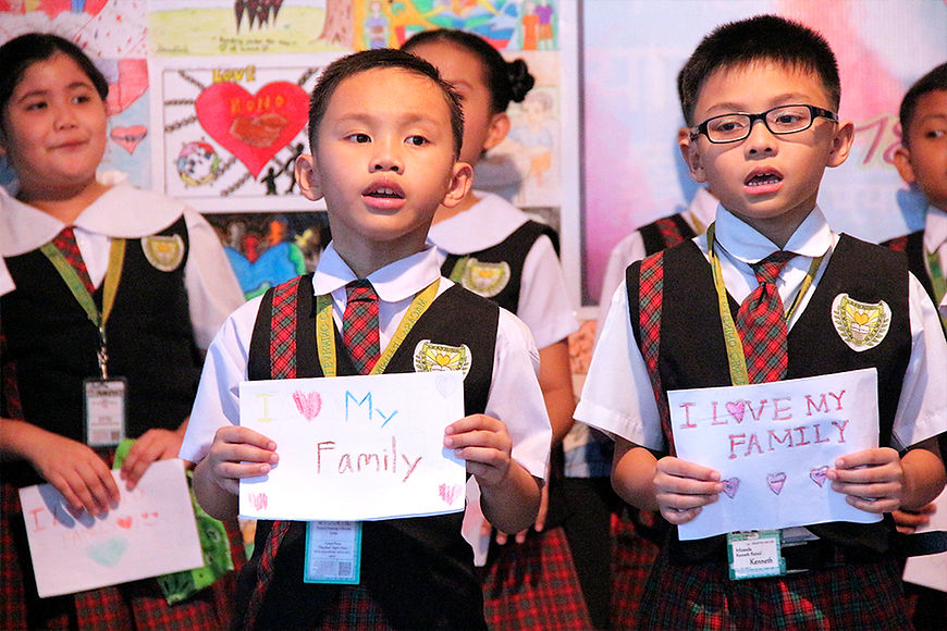 Students singing in their Family Week Program
