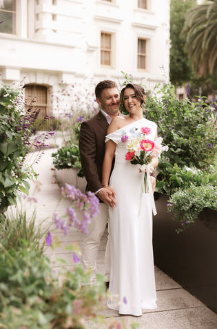 Abby and Andy walking to their ceremony at Melbourne Registry Office elopement