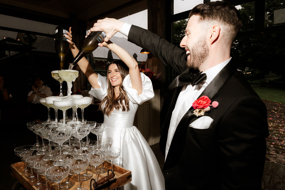 The champagne tower and cannoli cart from Cannoleria at Sam and Mitch's Flowerdale Estate wedding