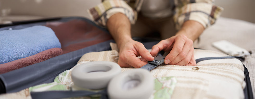 close-up-male-hands-man-fastening-clothes-inside-suitcase-packing-his-belongings-luggage-g