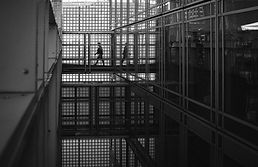 silhouette-man-walking-institut-du-monde-arabe-with-reflection-floor.jpg