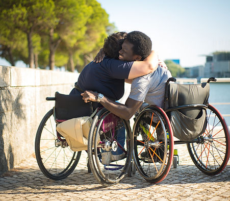 loving-family-wheelchairs-spending-time-near-water-african-american-man-caucasian-woman-ca