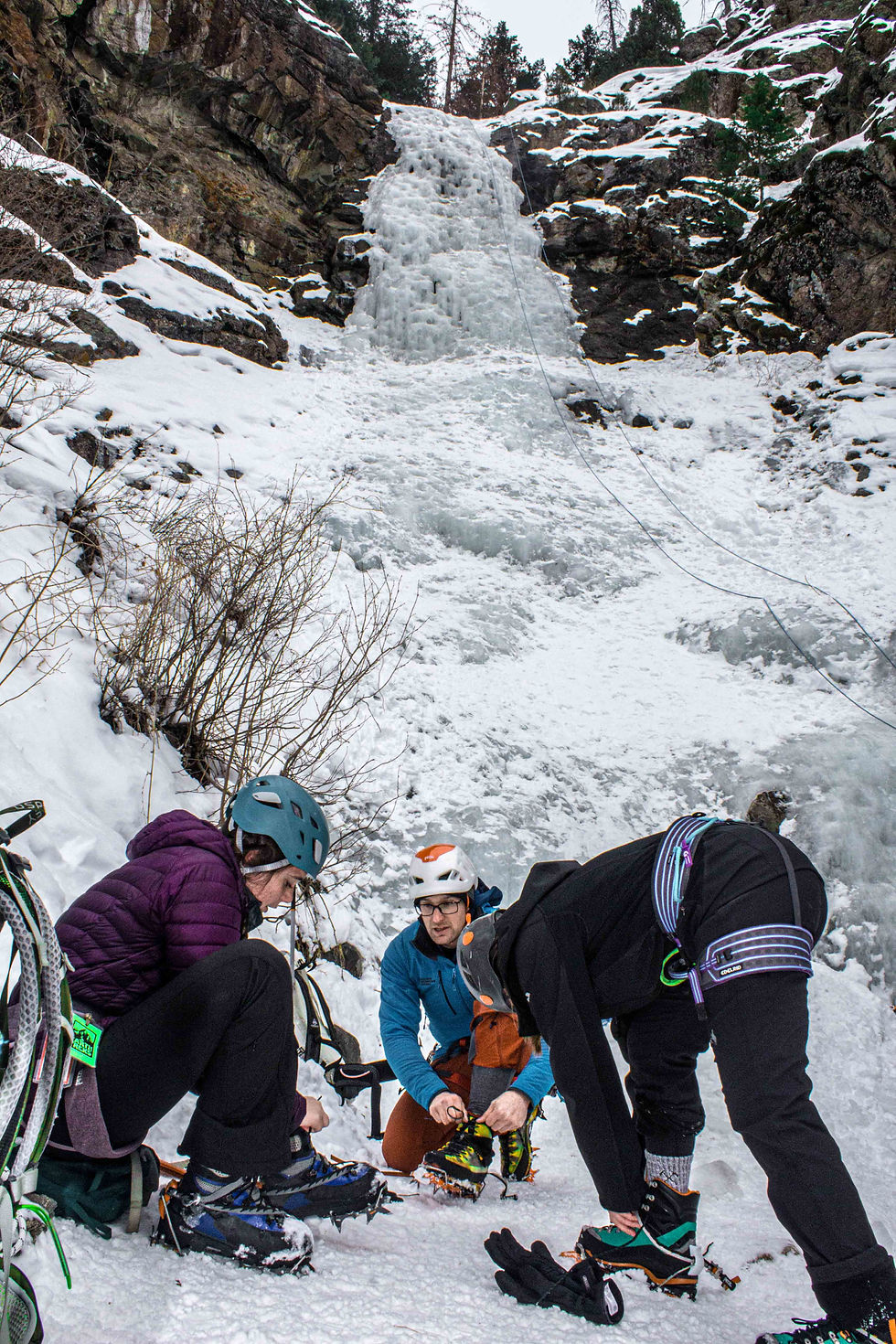 Ice climbing instructor prepares students for ice climb