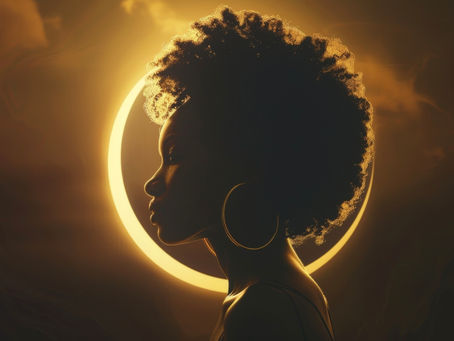 Side-profile portrait of a Black woman with afro and hoop earrings, backlit by a glowing gold ring halo in a moody haze.