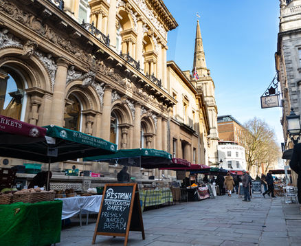 Visitors exploring the vibrant St Nicholas Market in Bristol