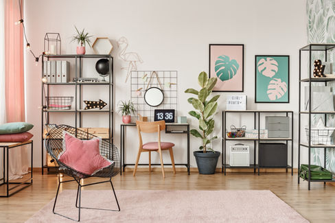 Room with stylish pink decor, featuring a blend of modern and vintage elements
