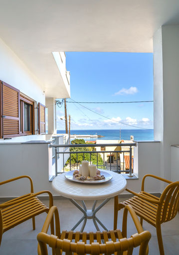 Balcony dining table with sea view in apartment Panormo Crete