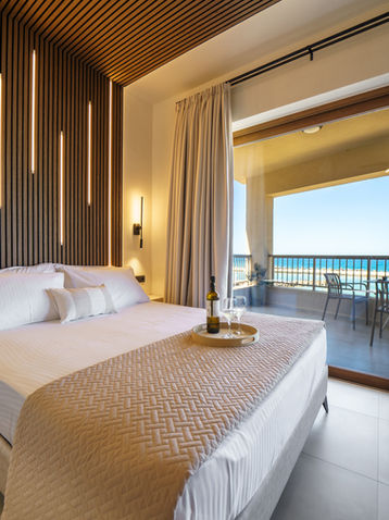 Modern bedroom interior in beachfront suite Panormo Crete