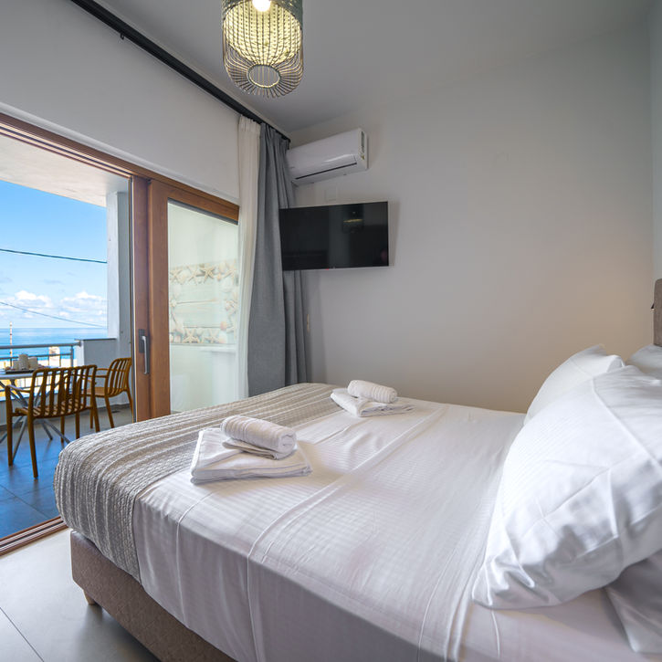 Double bed with sea view in modern apartment in Panormo Crete