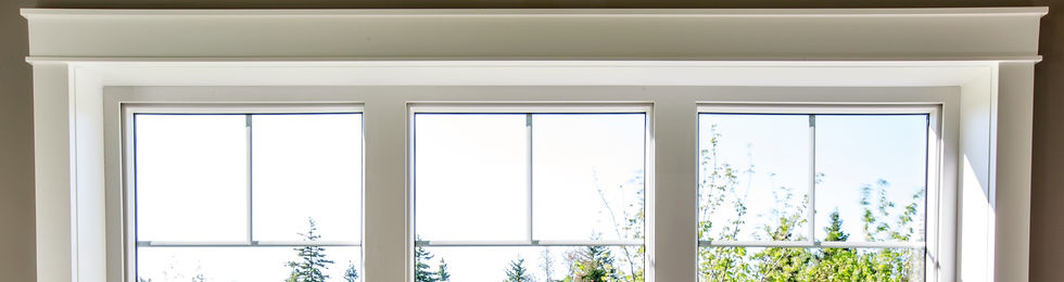 Three white windows in a white room