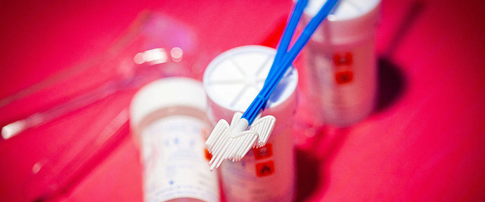 cervical brushes lying on top of ThinPrep Pap Test medium