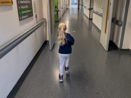 Penny in a hospital corridor