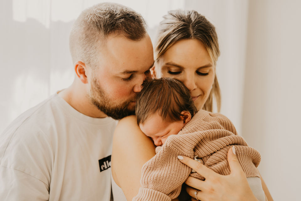 Mama und Papa mit Kind